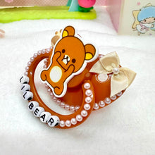 Load image into Gallery viewer, adult deco pacifier paci shop custom decorated binky for age regression store agere ddlg dd lg daddy dom little girl abdl baby diaper lover kawaii littlespace little space rhinestone deluxe kawaii rilakkuma brown bear sanrio paws 
