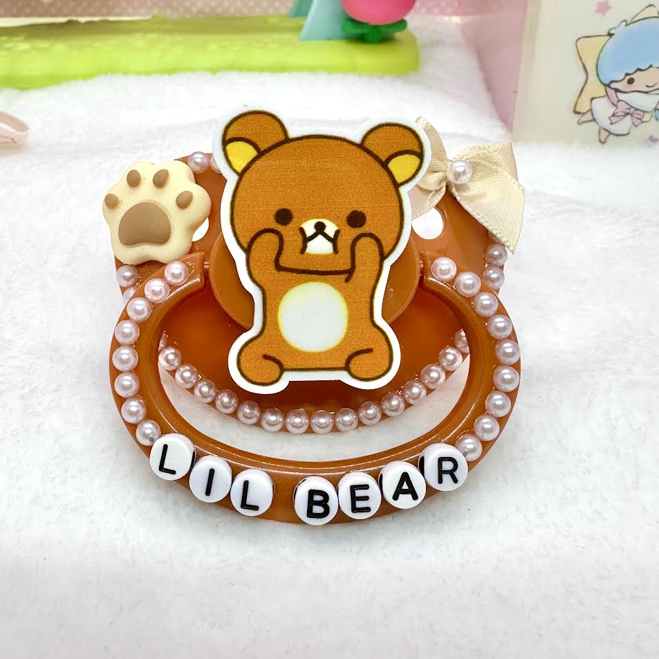adult deco pacifier paci shop custom decorated binky for age regression store agere ddlg dd lg daddy dom little girl abdl baby diaper lover kawaii littlespace little space rhinestone deluxe kawaii rilakkuma brown bear sanrio paws 